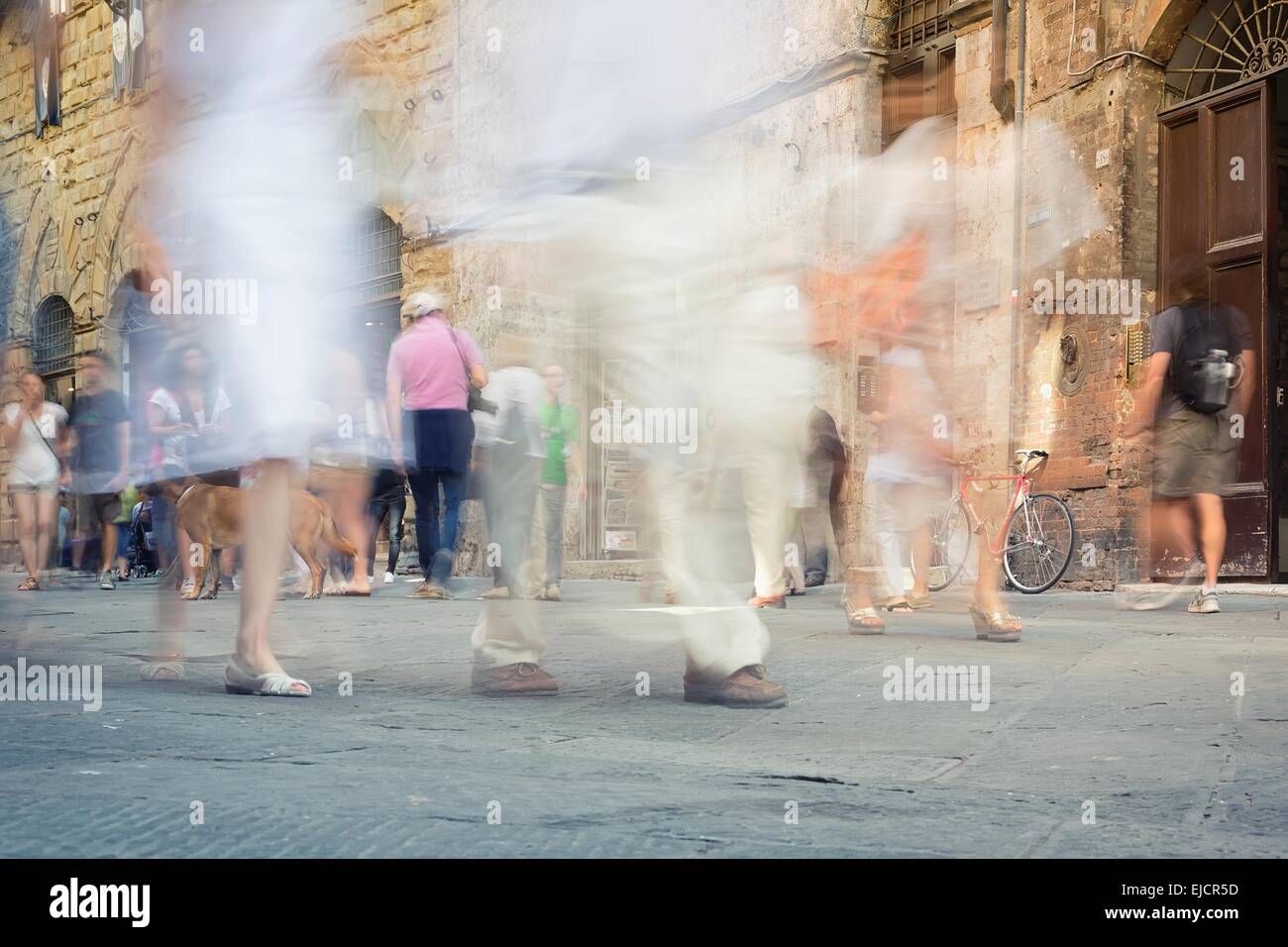 Moving Ina Crowd Fast moving crowd on the sidewalk city Stock Photo - Alamy