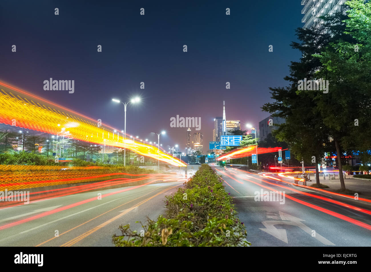 dramatic light trails on the city road Stock Photo