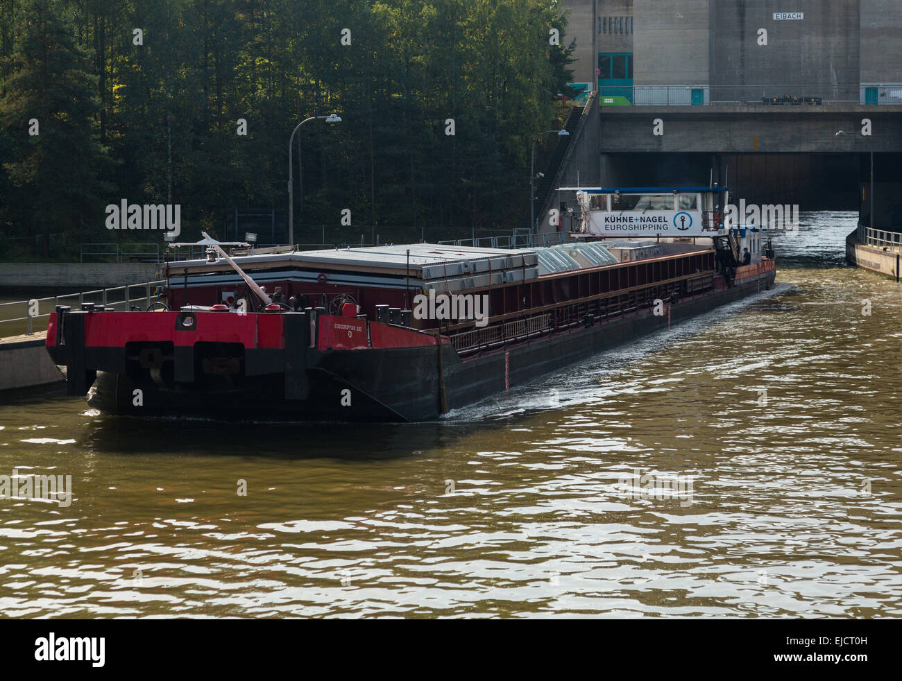 Freight barge leaves Eibach lock on canal Stock Photo