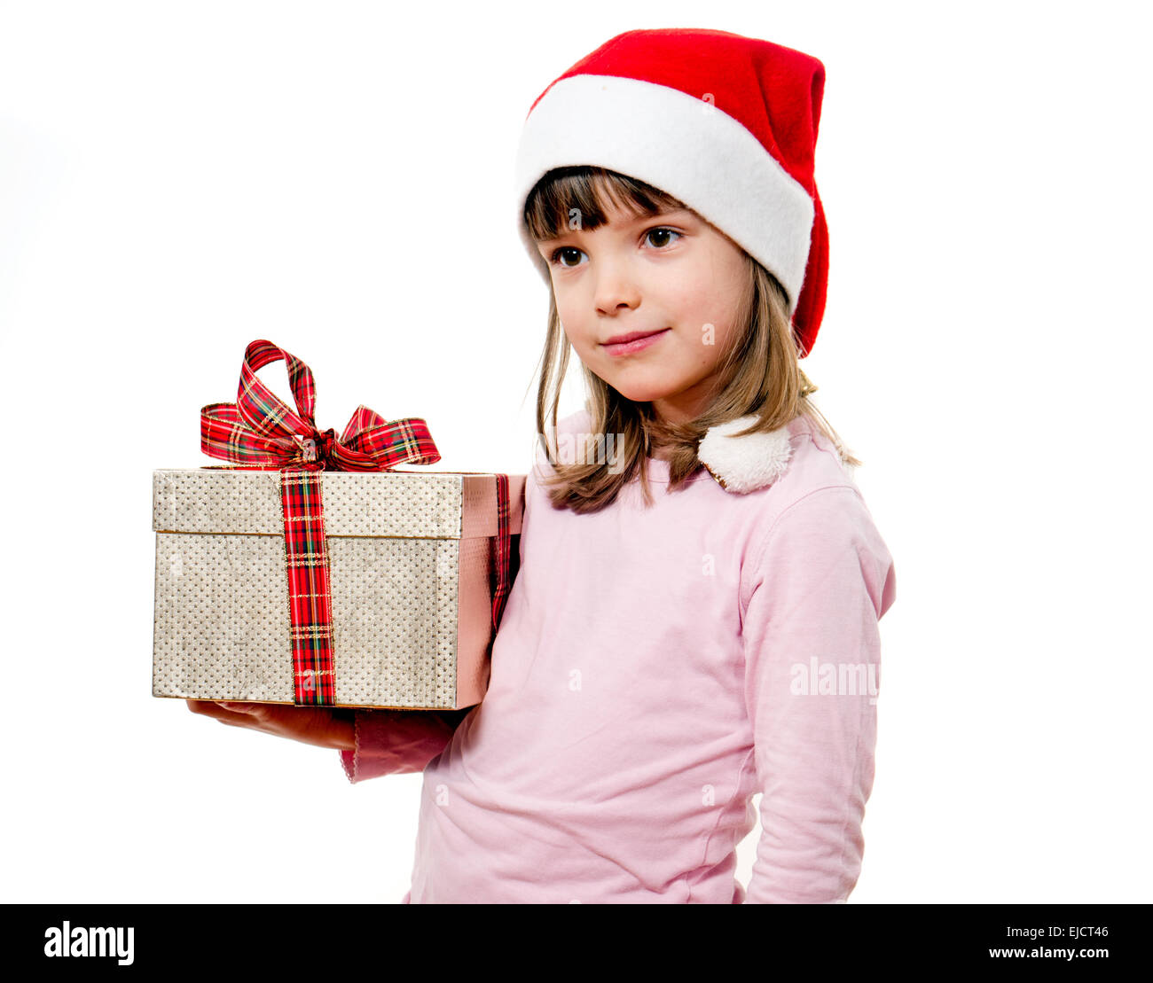 Child with Santa Claus hat holding gift Stock Photo