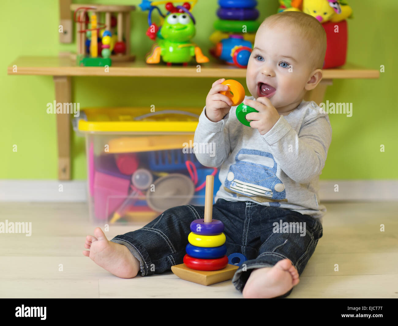 Llittle boy at play in his room Stock Photo