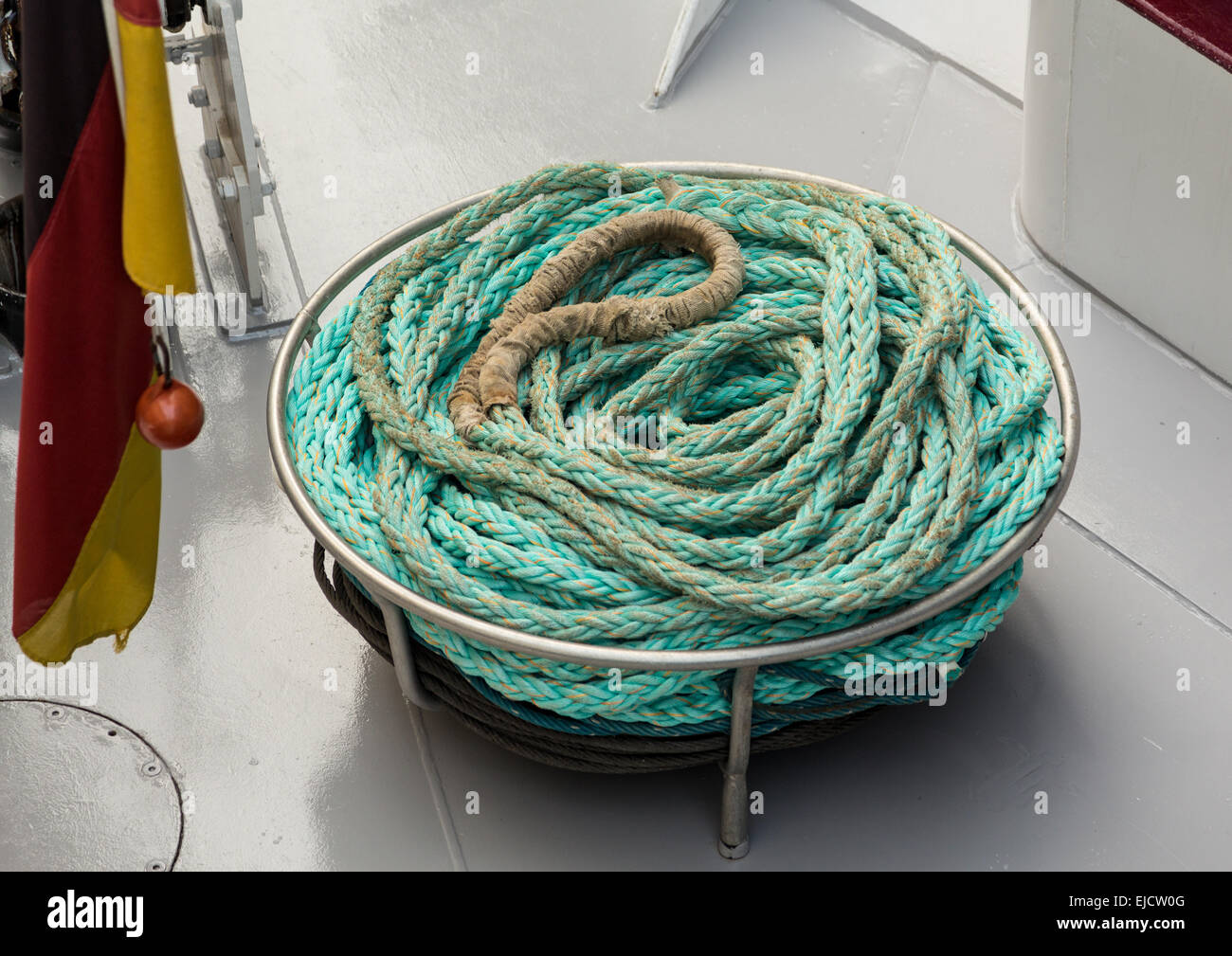Coil of blue nylon rope on deck Stock Photo