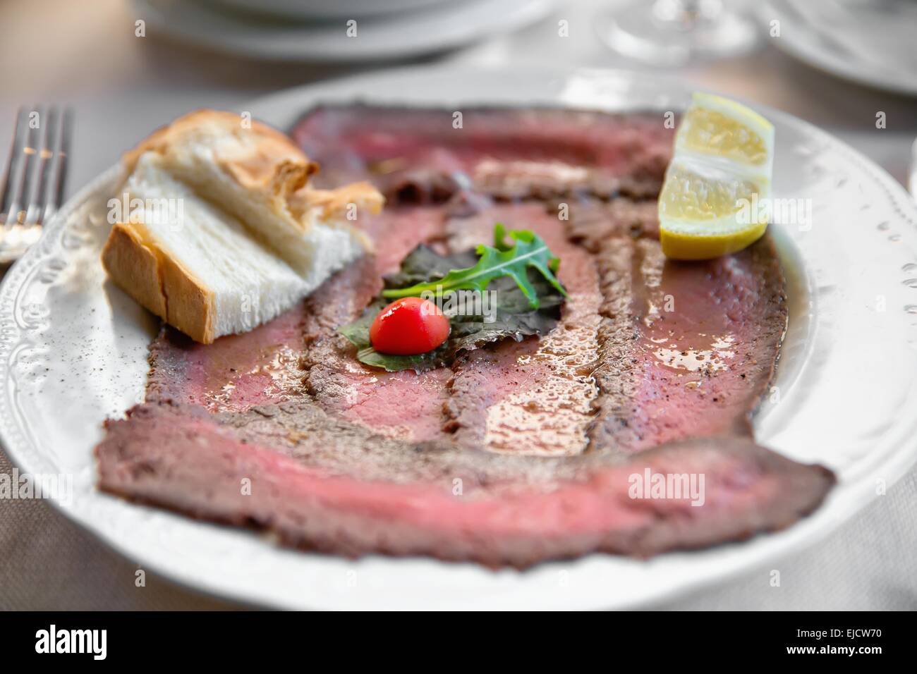 Well roast beef thinly sliced Stock Photo Alamy