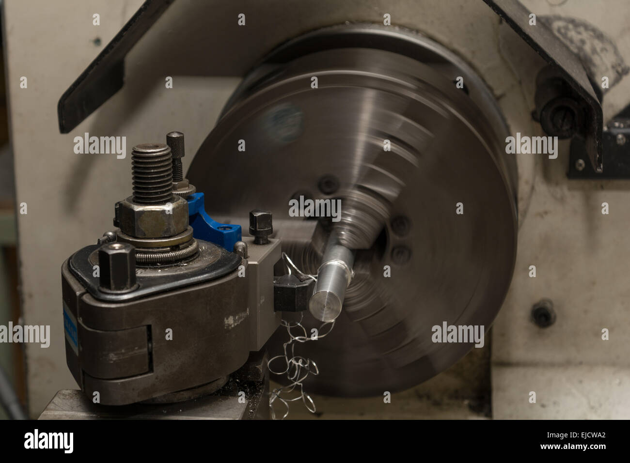 Metalworking with lathe Stock Photo