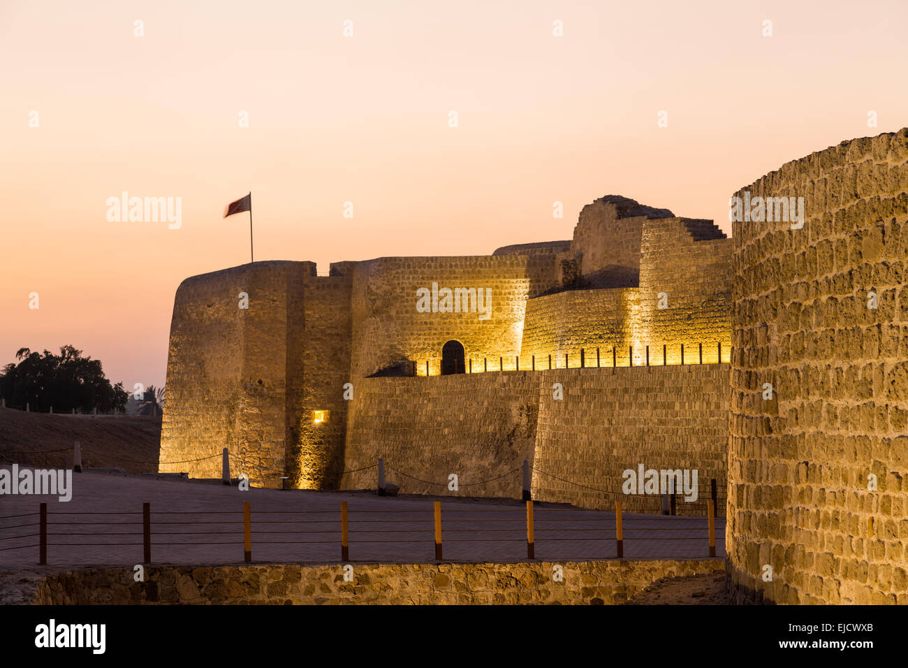 Old Bahrain Fort at Seef at sunset Stock Photo