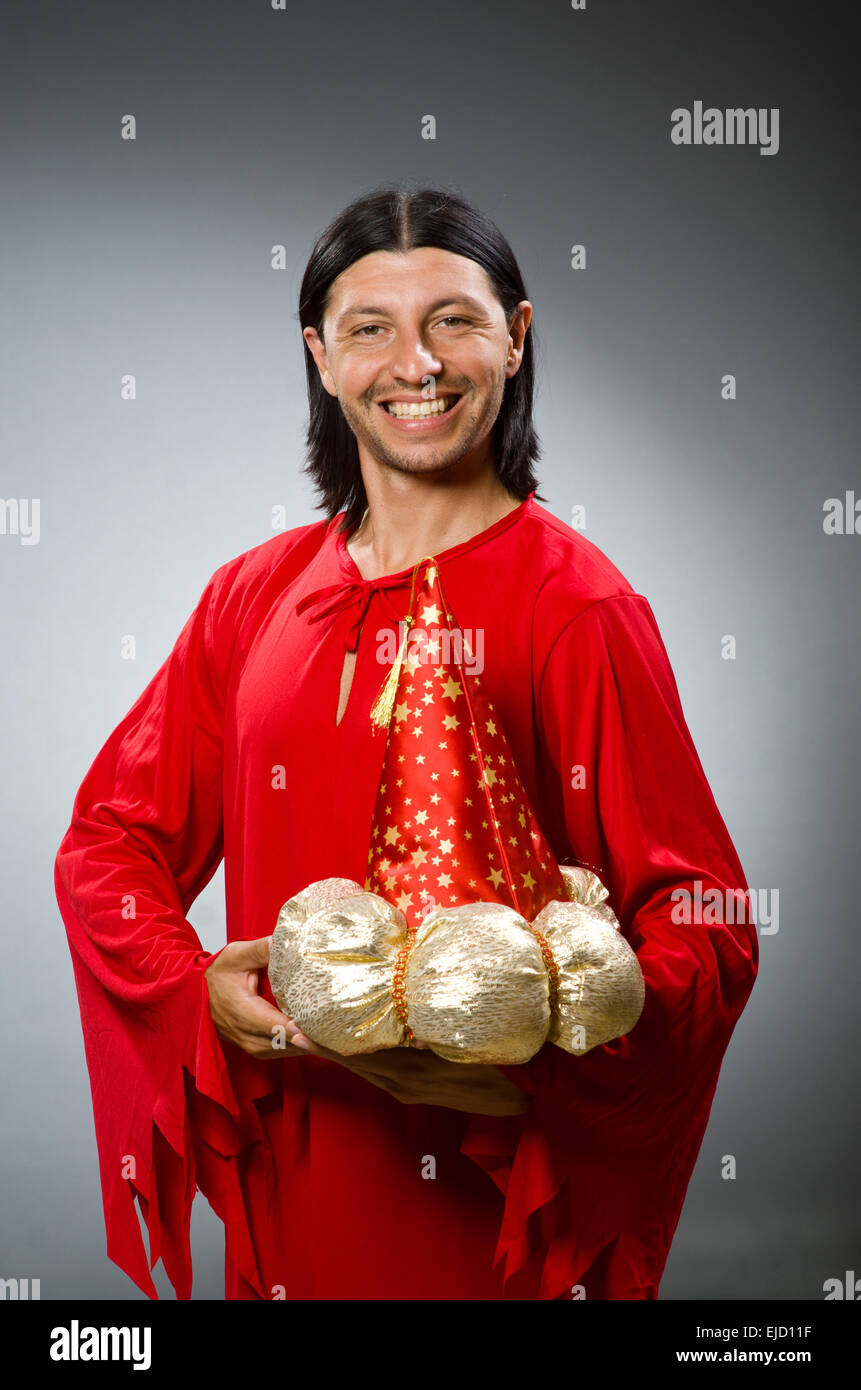 Funny wizard wearing red dress Stock Photo - Alamy