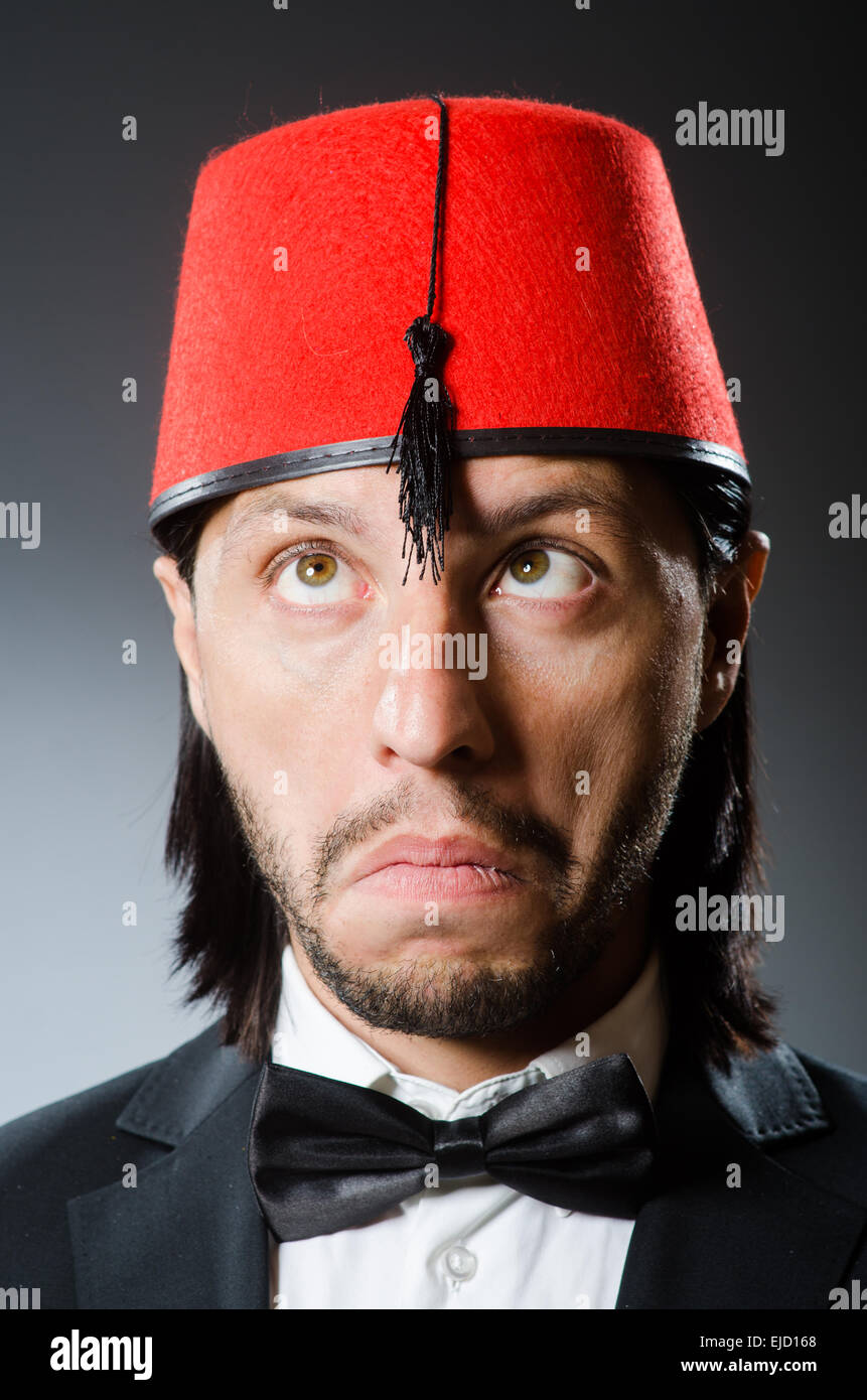 Man in traditional turkish hat and dress Stock Photo