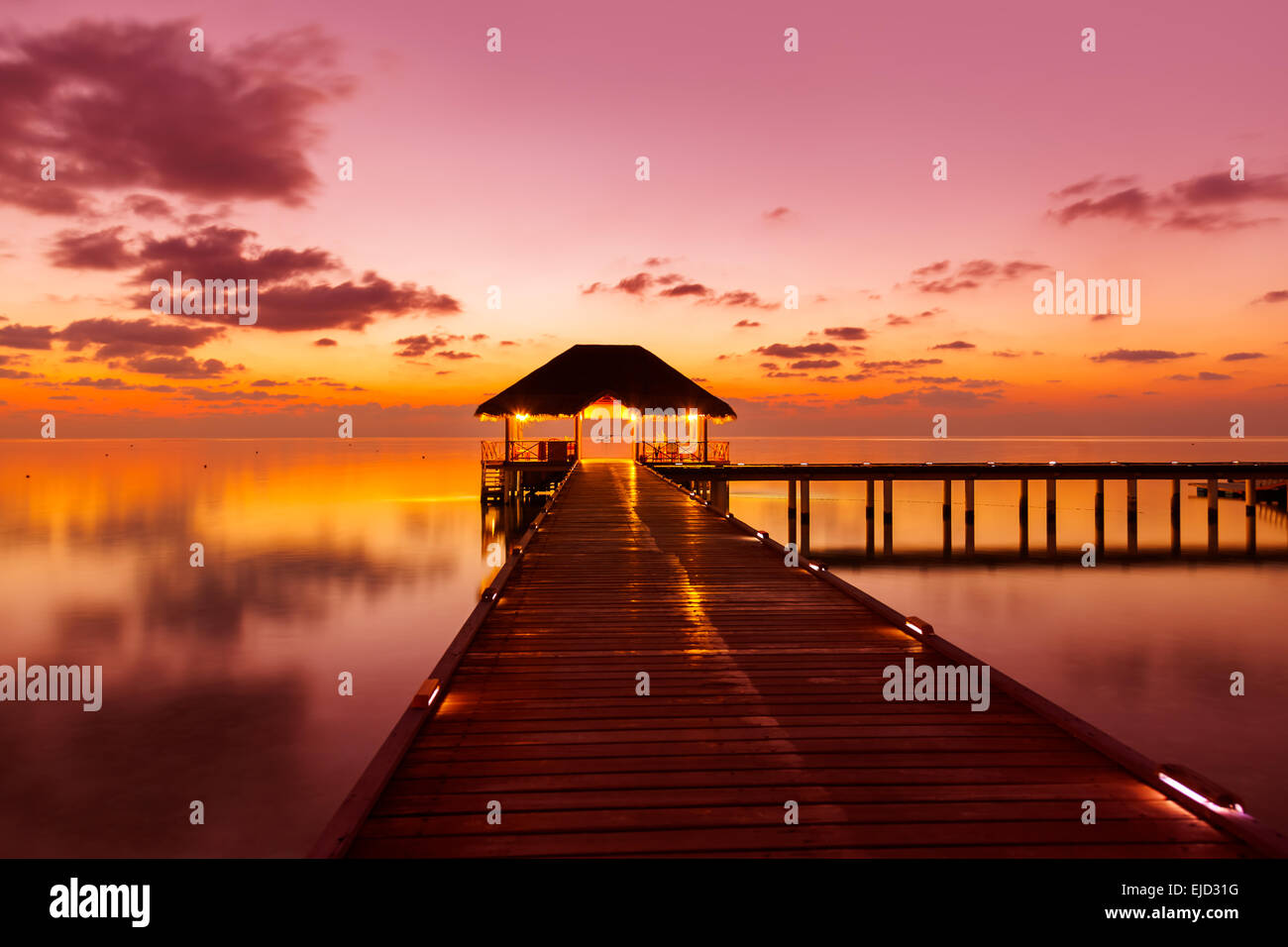 Water cafe at sunset - Maldives Stock Photo