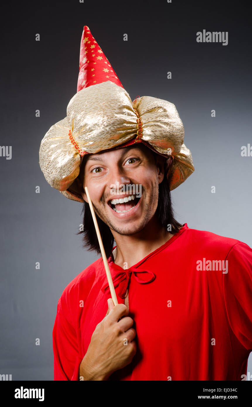 Funny wizard wearing red dress Stock Photo - Alamy