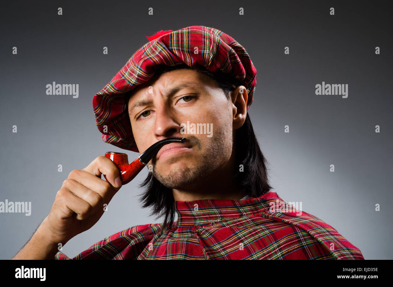 Funny scotsman with smoking pipe Stock Photo Alamy