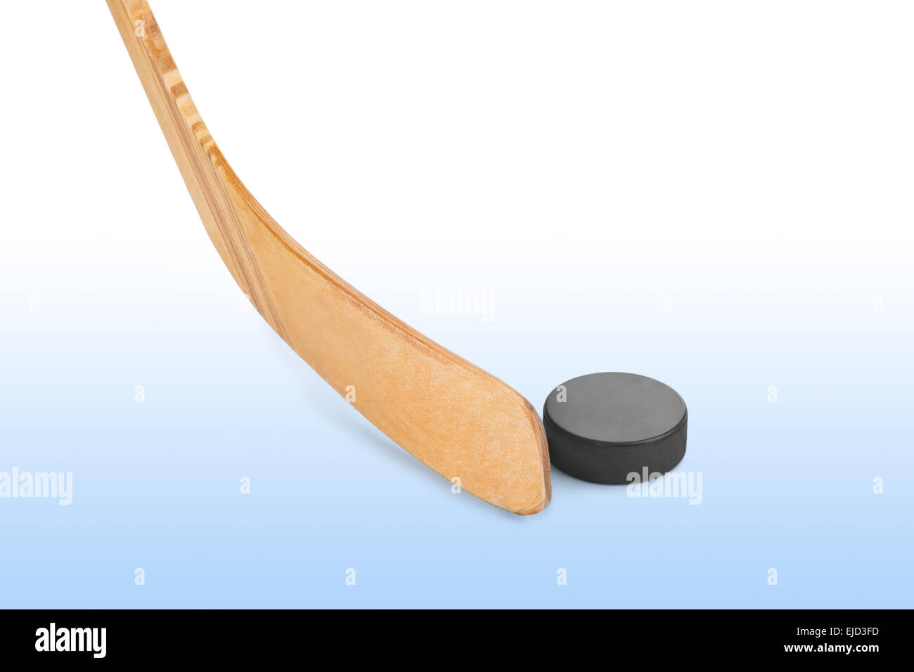 Ice hockey stick and puck Stock Photo Alamy