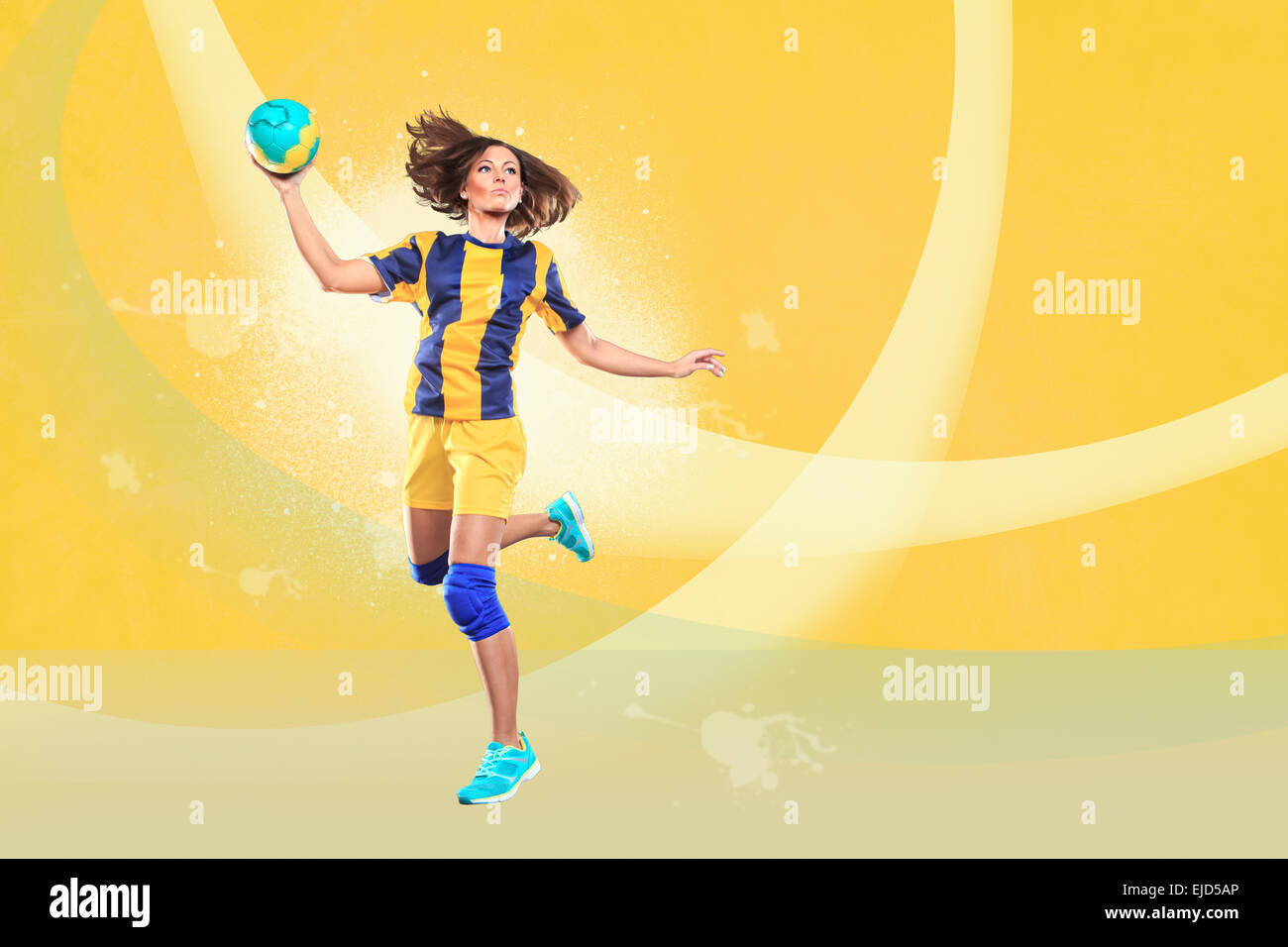female handball player with a ball on the field Stock Photo