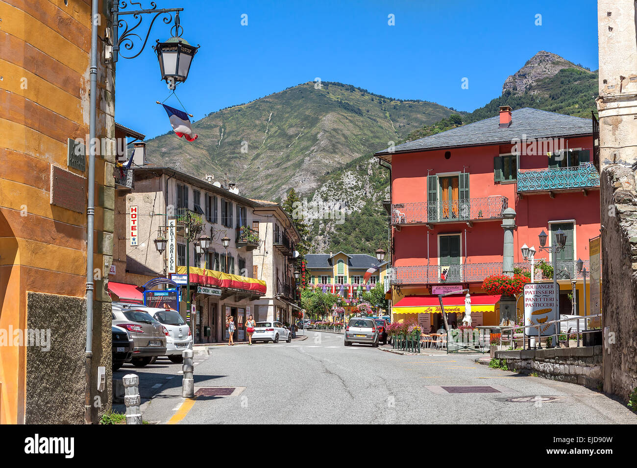 Narrow urban road among colorful houses in Tende, France. Stock Photo