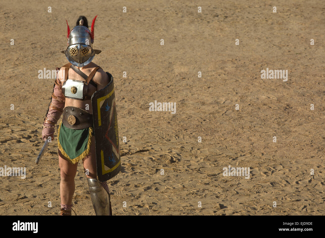 Performing of gladiators fighting of Merida's Amphitheater. Samnita on the sand Stock Photo
