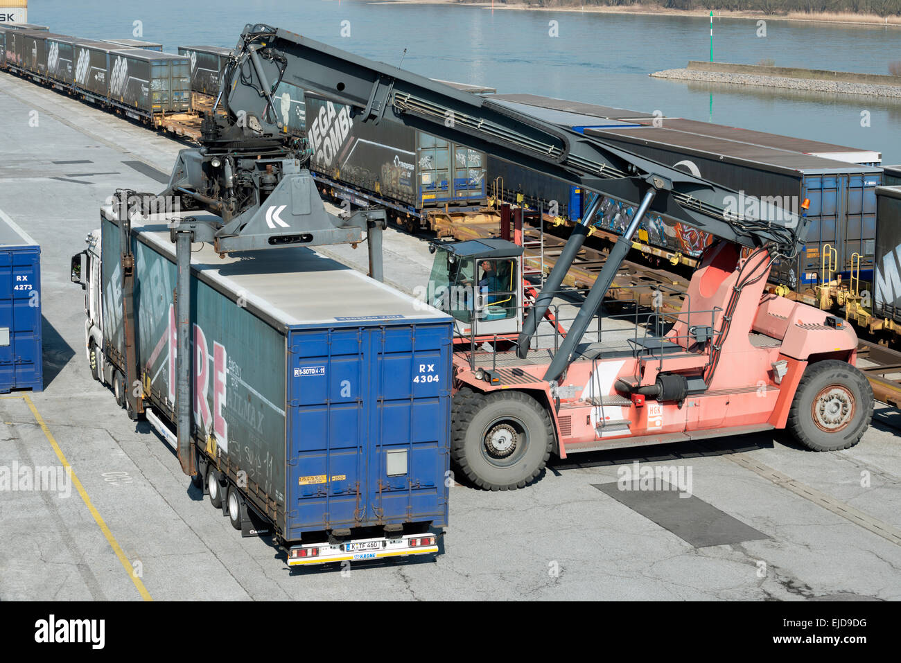 Container loaded onto lorry at Niehl container terminal, Cologne, Germany. Stock Photo