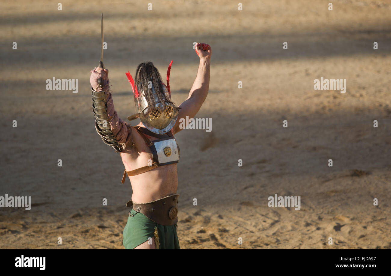 Performing of gladiators fighting of Merida's Amphitheater. Samnita victory Stock Photo