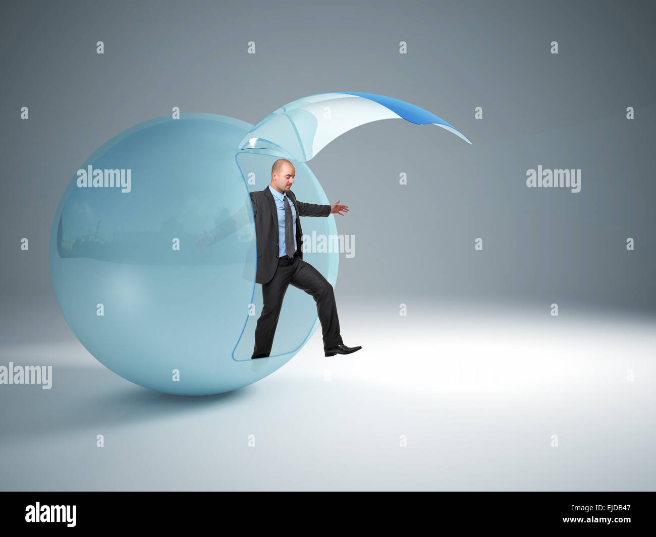man try to exit from his glass sphere Stock Photo