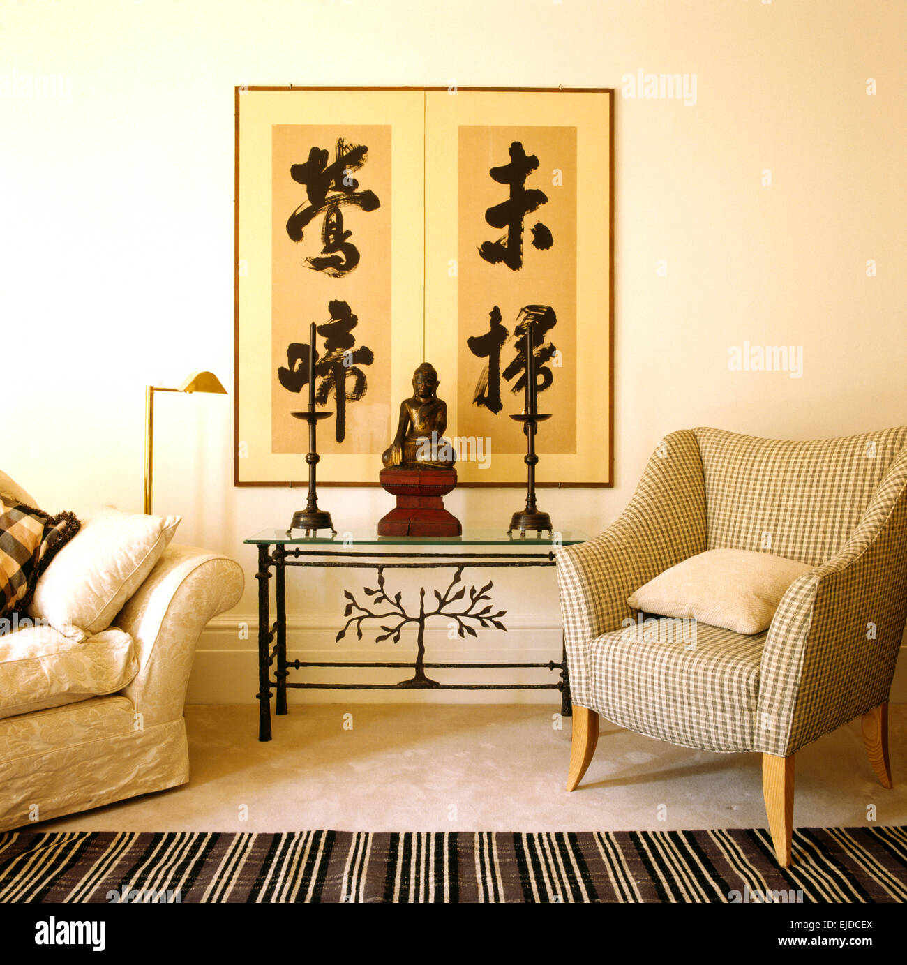 Framed Oriental Scroll On Wall Above Metal Console Table In