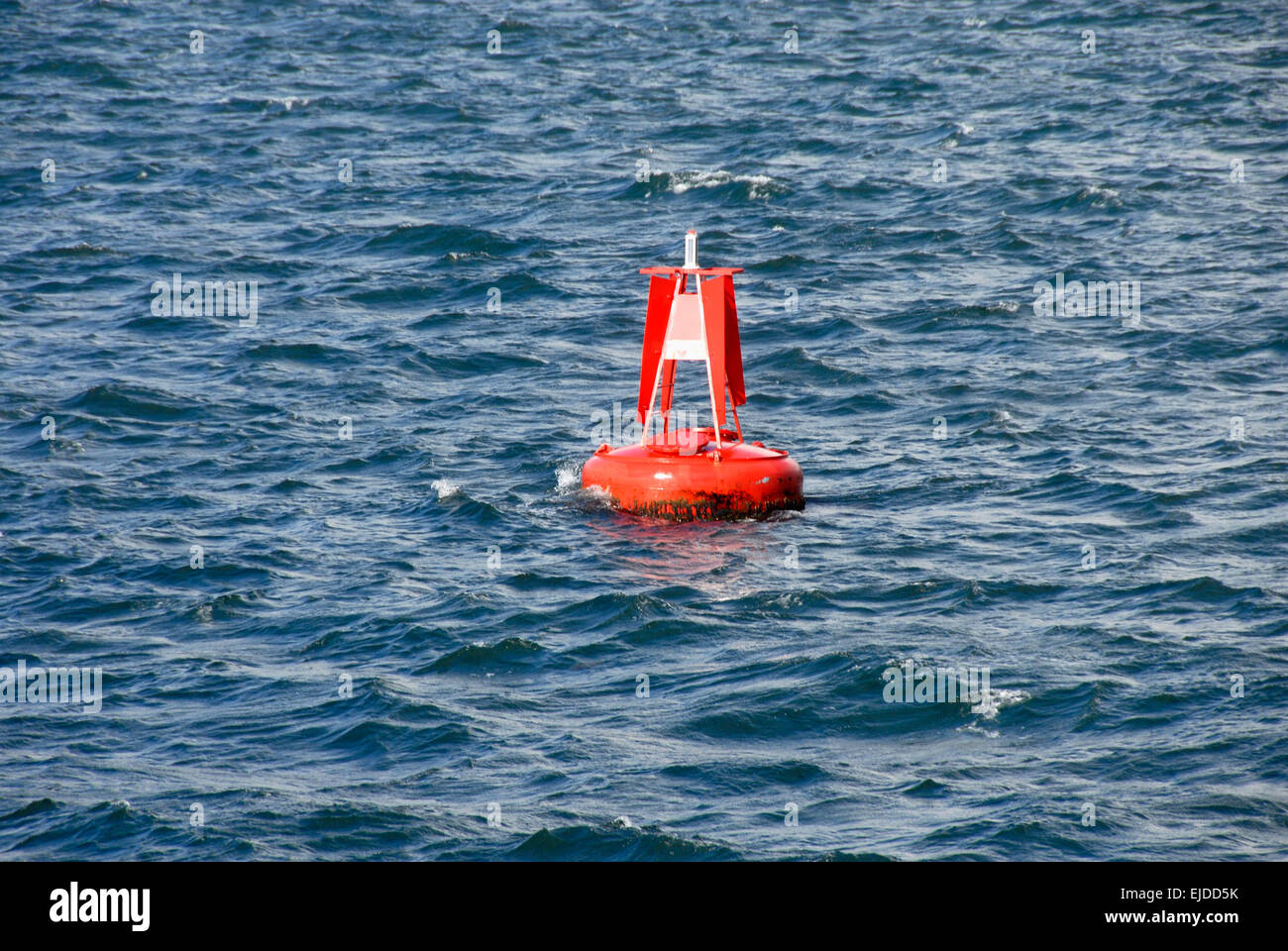 Red marker buoy in sea Stock Photo