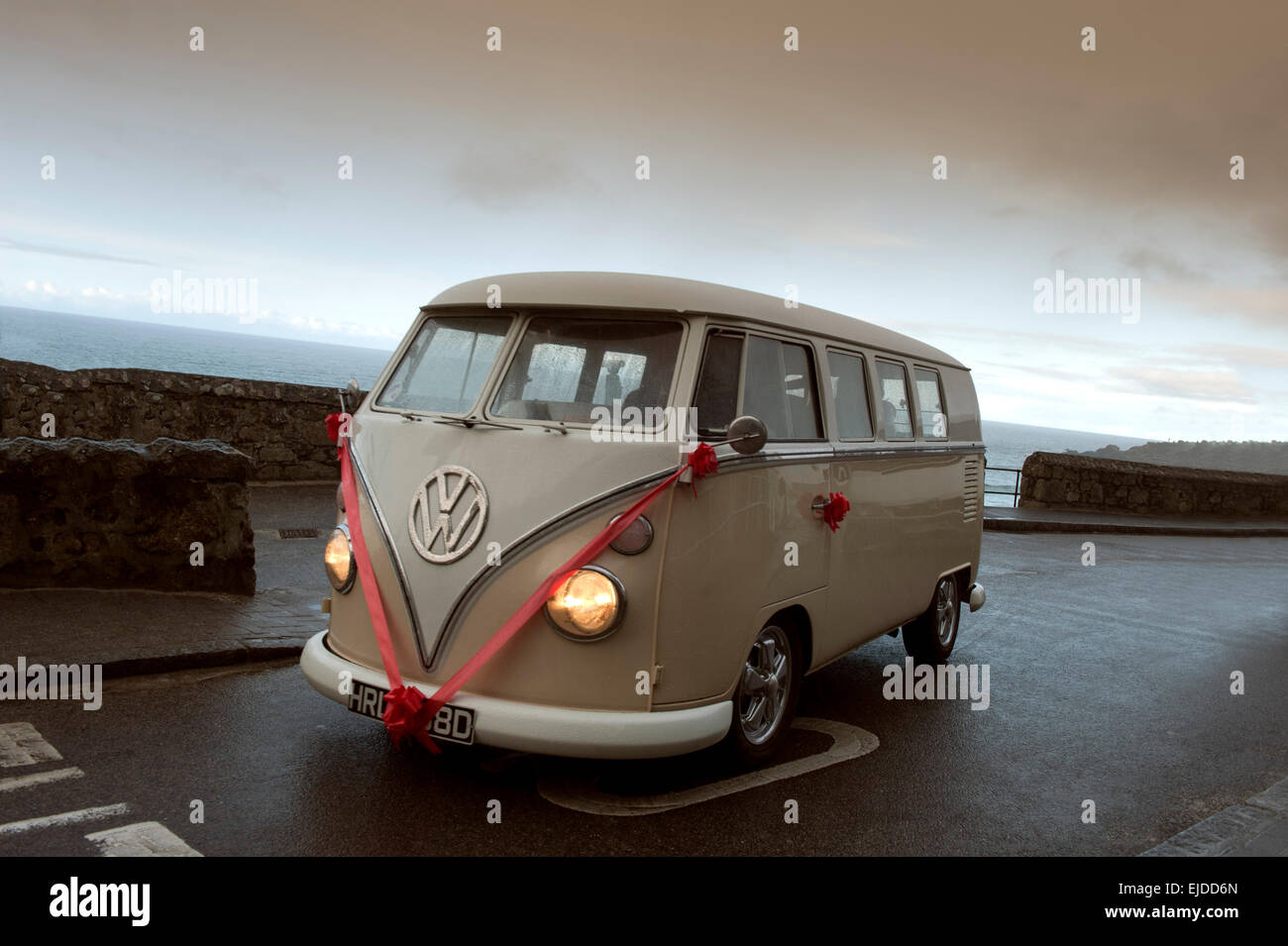 Vintage Volkswagen VW Bus ca. 1965 decorated for a wedding on a rainy day in St. Ives Cornwall England UK Europe Stock Photo