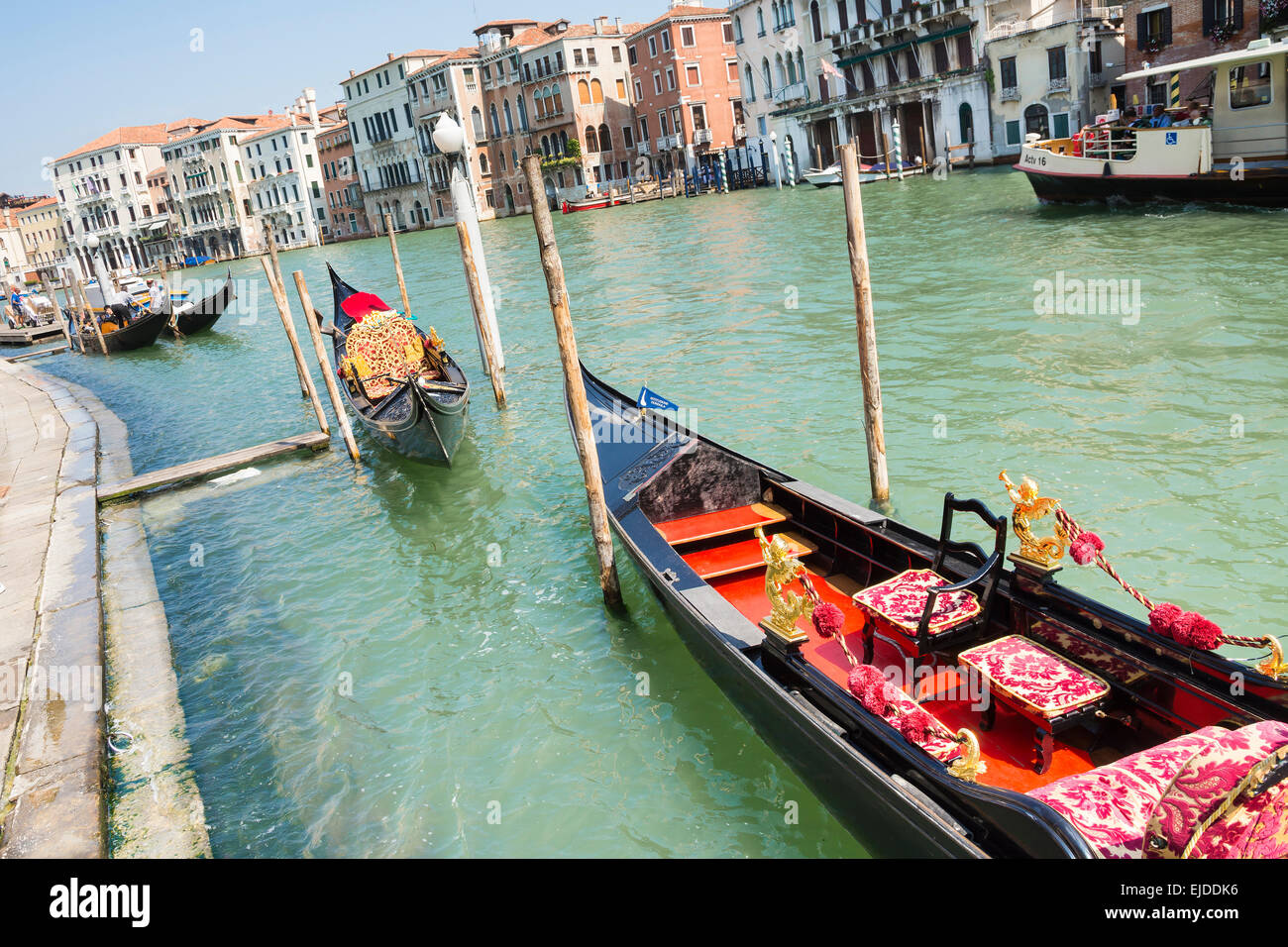 Venice,Italy-August 12,2014:Traditional venetian gondola await some tourists to carry around on a gondola in Venice During a sun Stock Photo
