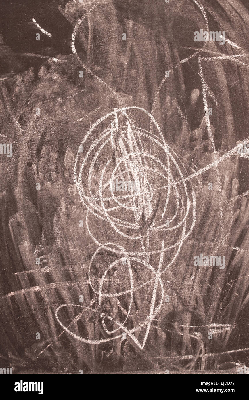 White chalk marks and swirls on a black slate chalk board Stock Photo