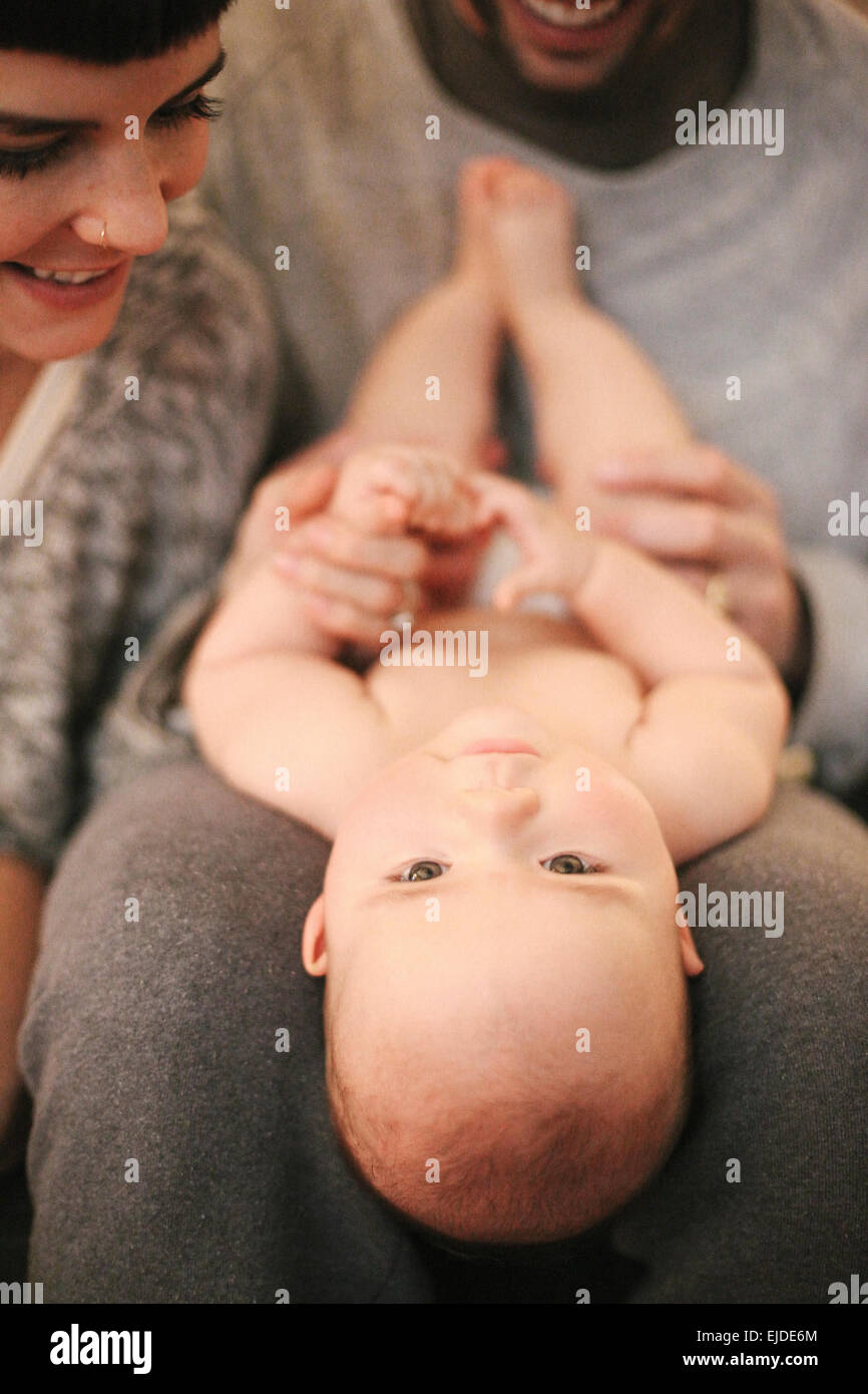 A mother and father with their small baby. Stock Photo