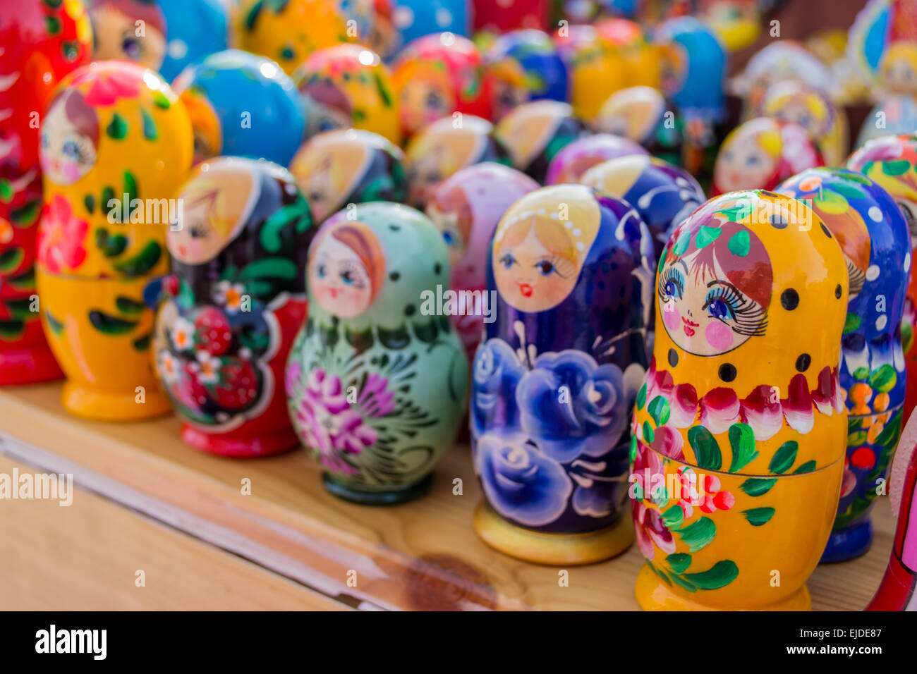 Colourful wooden nesting dolls from Russia in different colors Stock
