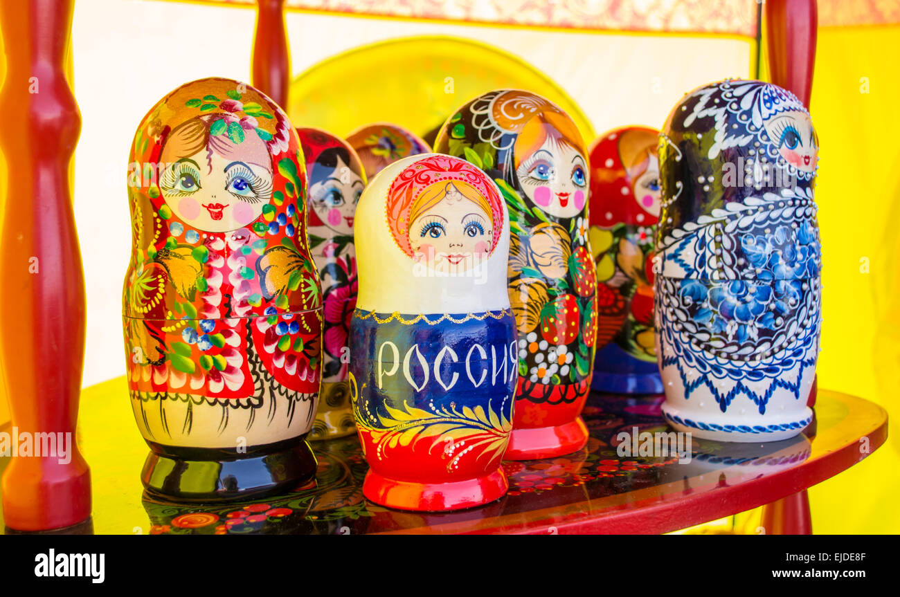 Traditional Russian puzzle dolls on display in various colours Stock