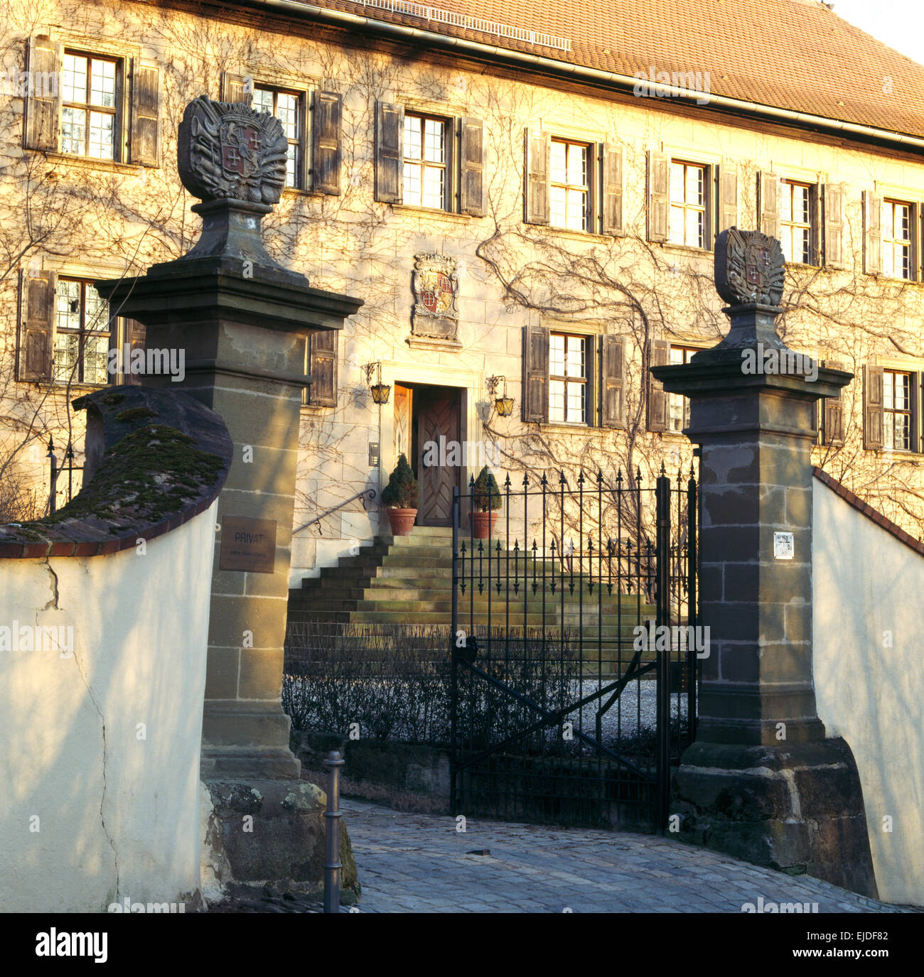 Exterior of grand country house in Germany with wrought iron gates Stock Photo