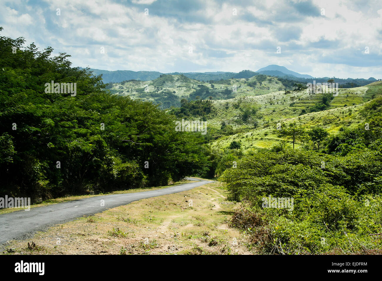 Lombok, Indonesia. Hills and narrow track winding through Indonesian countryside. Stock Photo