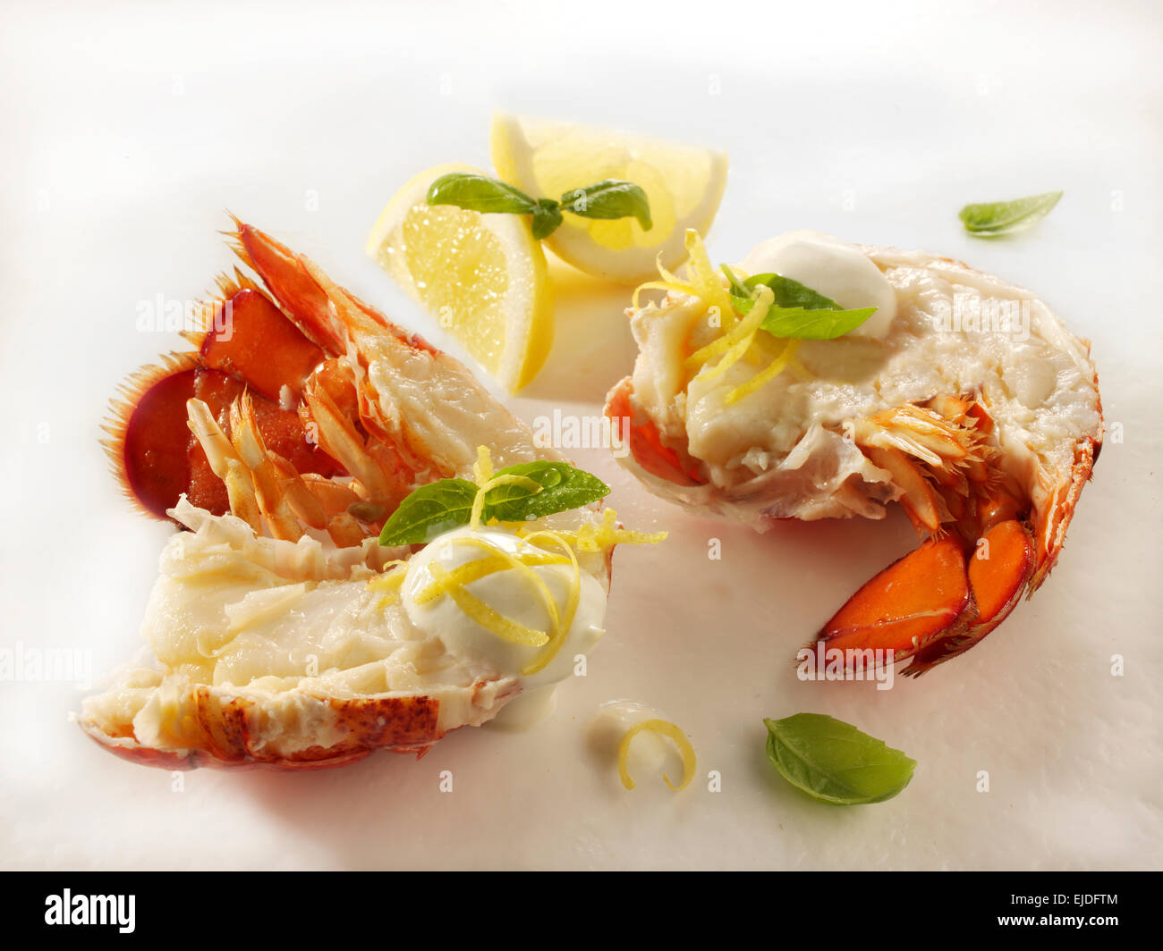 Halved fresh cooked Lobster ( crawfish) with a lemon mayonnaise sauce Stock Photo
