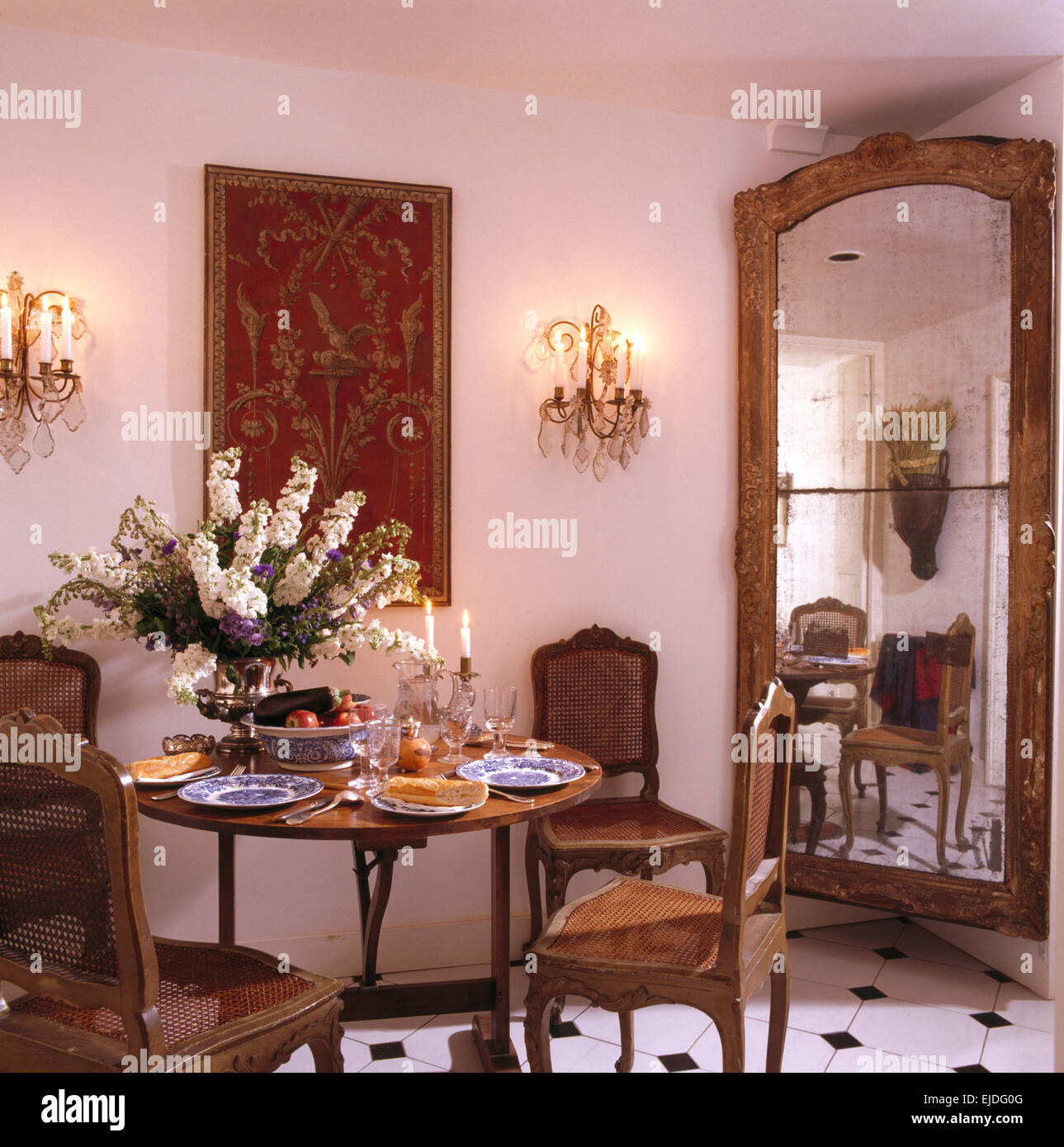 Tall antique mirror in corner of townhouse dining room with antique ...