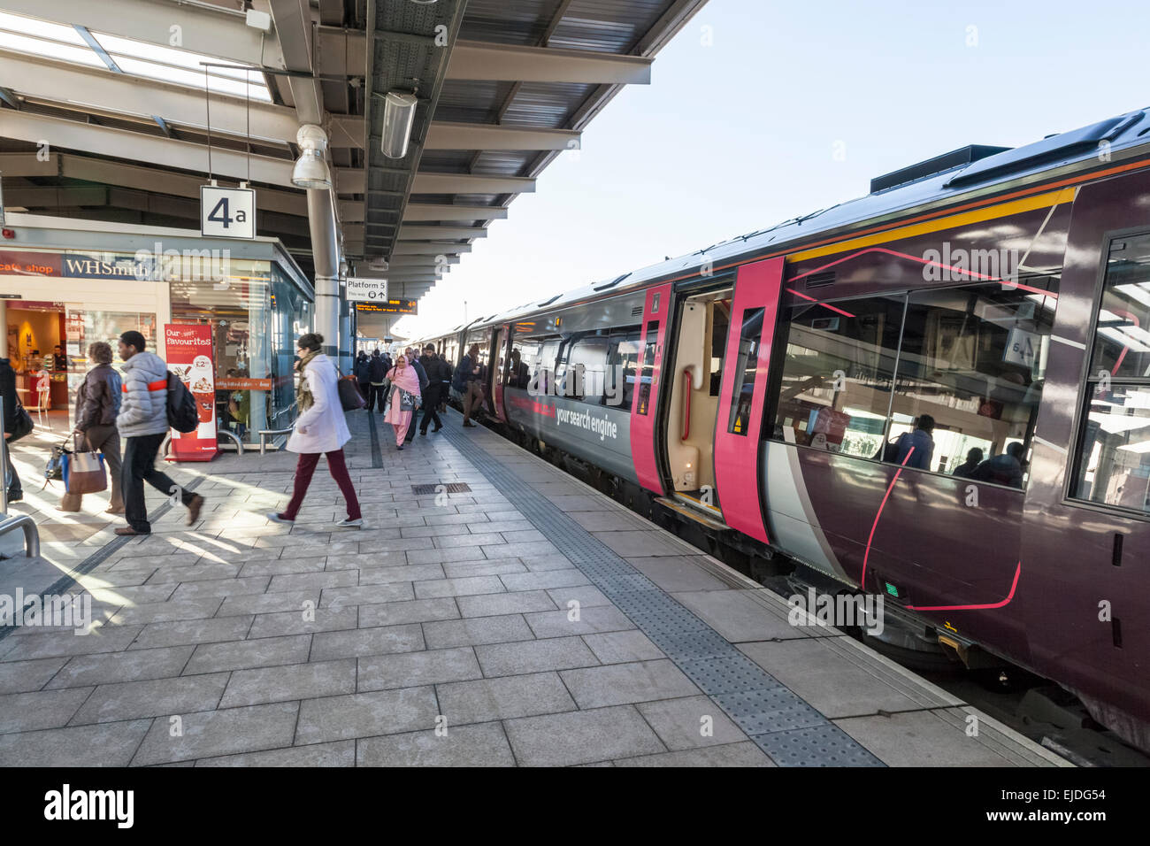 Passengers leaving a train at Derby Railway Station, England, UK Stock Photo