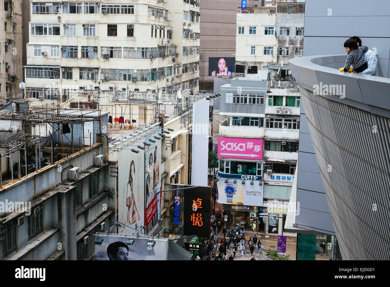 Father and child enjoys the view from the Hysan shopping centre of the busy Causeway Bay shopping area Stock Photo