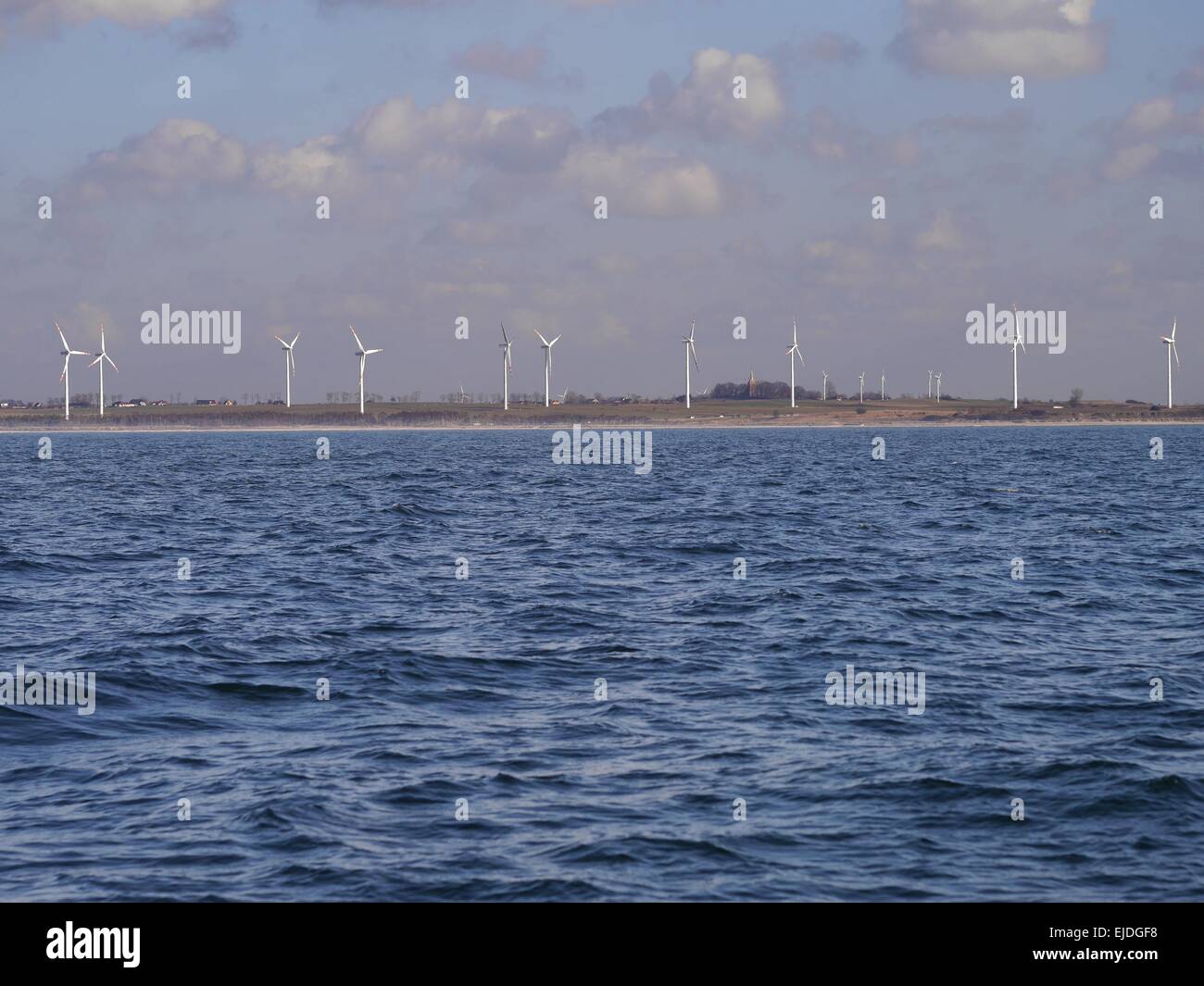 wind turbine on blue sky background Stock Photo - Alamy
