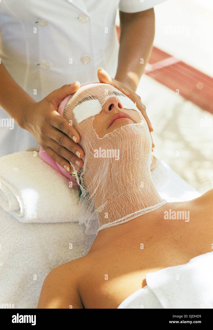 Beauty therapist giving a facial to a spa hotel guest      FOR EDITORIAL USE ONLY Stock Photo