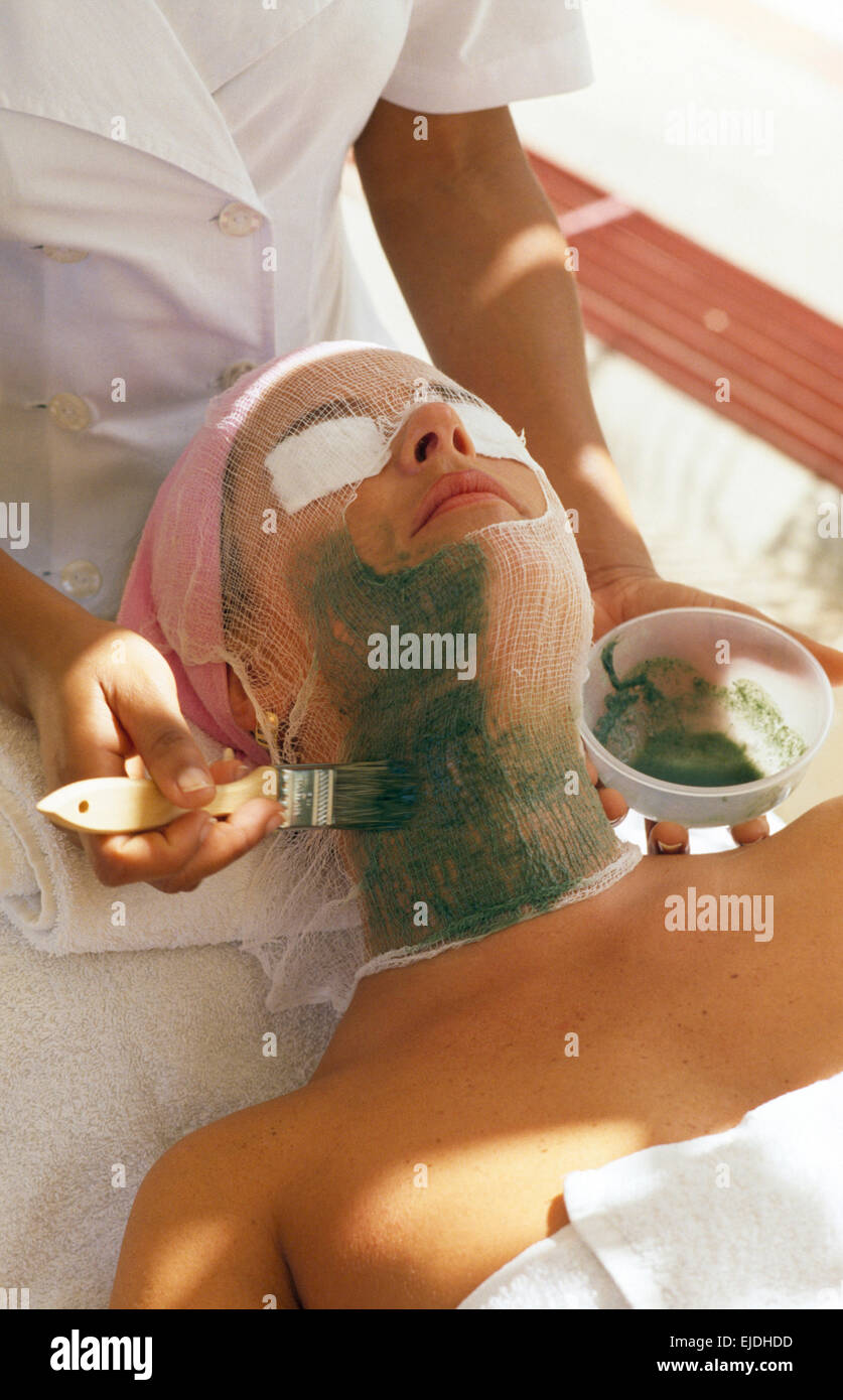 Beauty therapist giving a mud facial to a spa hotel guest        FOR EDITORIAL USE ONLY Stock Photo