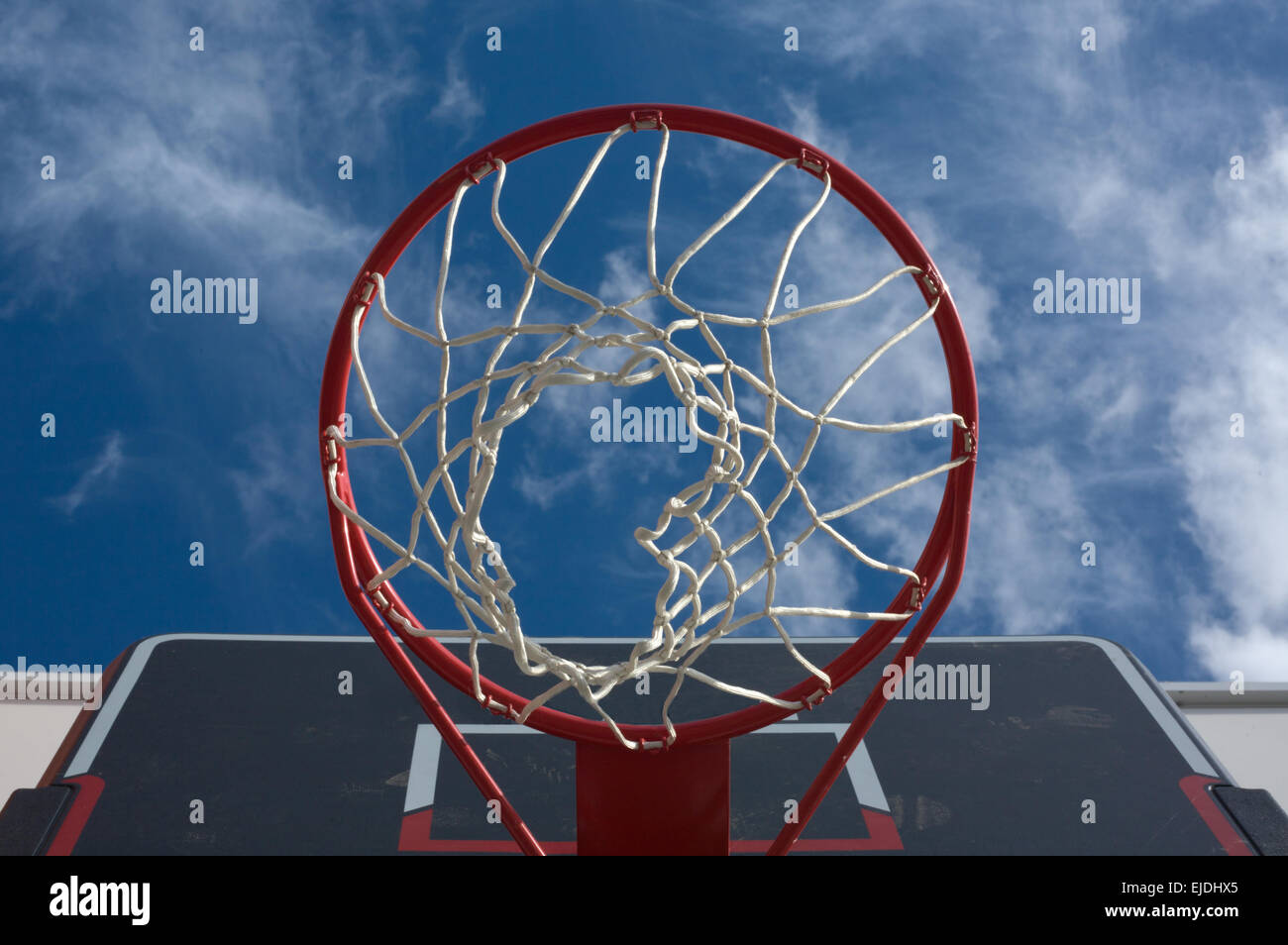 New basketball hoop from below against a cloudy sky Stock Photo Alamy