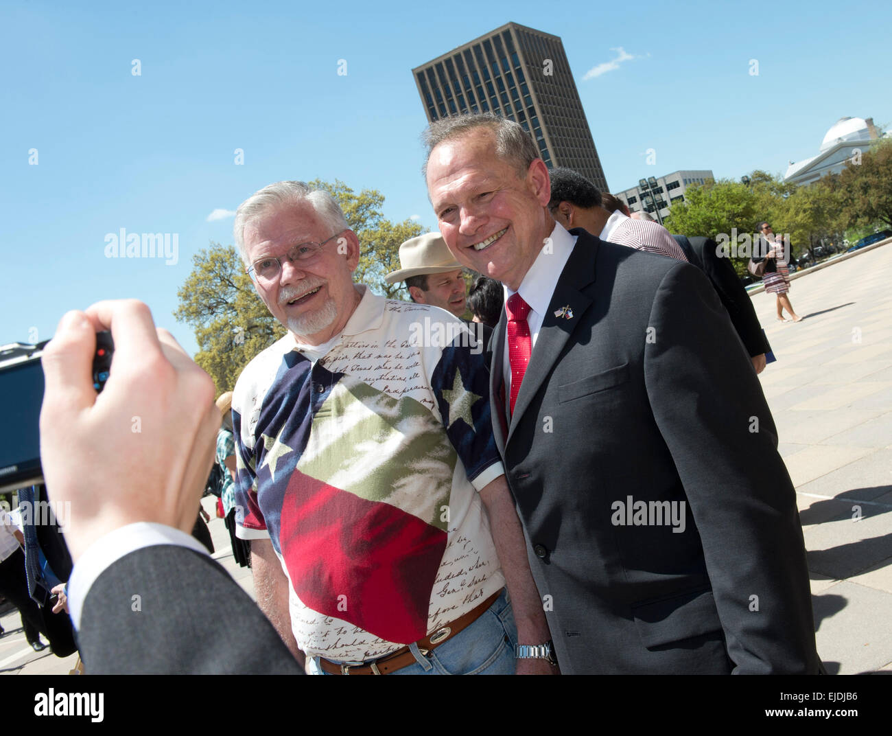 Austin, Texas, USA. 23rd March, 2015. Controversial  Alabama Supreme Court Chief Justice Roy Moore poses with a fan after speaking at a rally of conservative Texas legislators opposing gay marriage at a Texas Capitol rally Monday.  Moore has told Alabama judges to ignore a recent federal court ruling allowing gay marriage in the state. Credit:  Bob Daemmrich/Alamy Live News Stock Photo