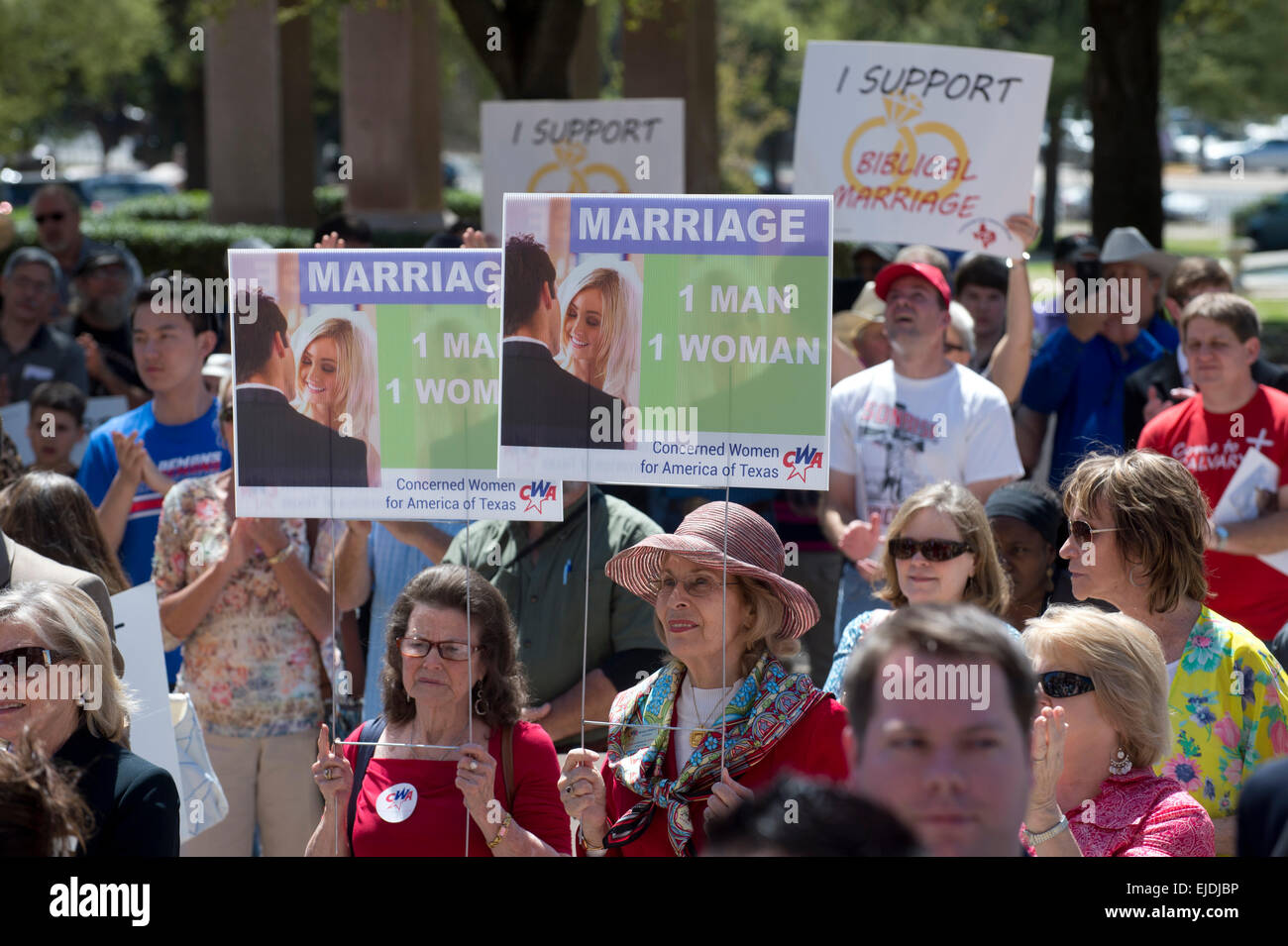 Austin, Texas, USA. 23rd March, 2015. Anti-gay marriage protesters hold signs as controversial  Alabama Supreme Court Chief Justice Roy Moore speaks at a rally of conservative Texas legislators opposing gay marriage at a Texas Capitol rally Monday.  Moore has told Alabama judges to ignore a recent federal court ruling allowing gay marriage in the state. Credit:  Bob Daemmrich/Alamy Live News Stock Photo