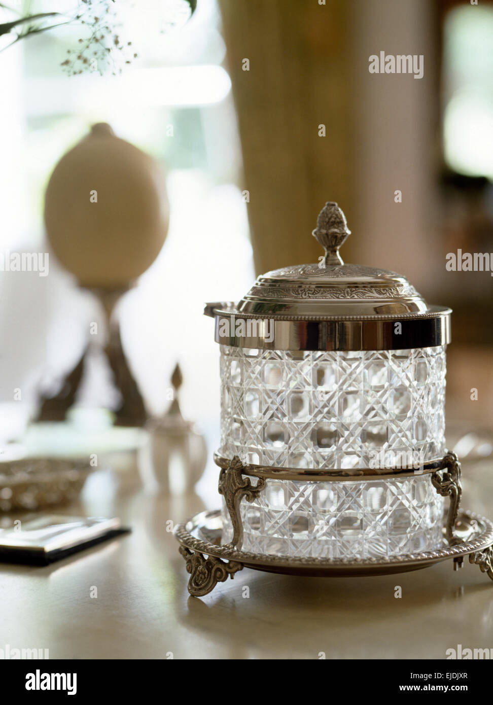 Close-up of a cut glass, silver topped jam pot Stock Photo