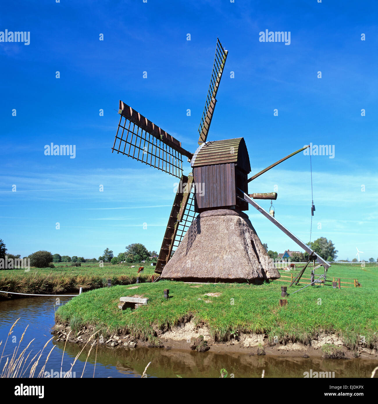 Craftsmen working on windmill restoration in Friesland