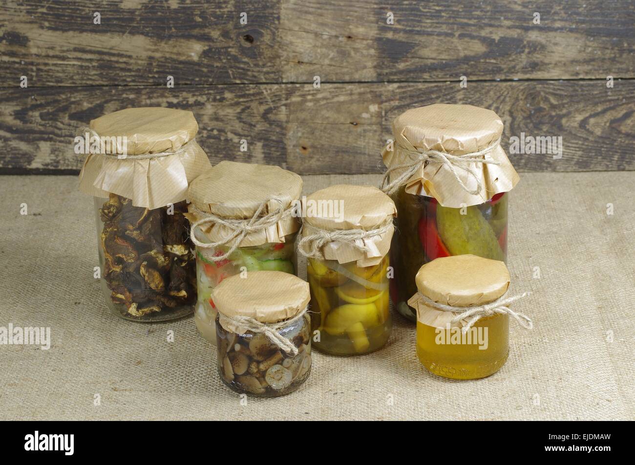 jars of preserved canned vegetable and honey Stock Photo