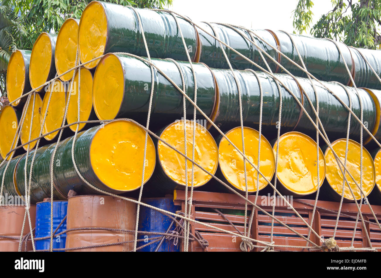 colorful metal oil barrels stacked  for cargo in India Stock Photo