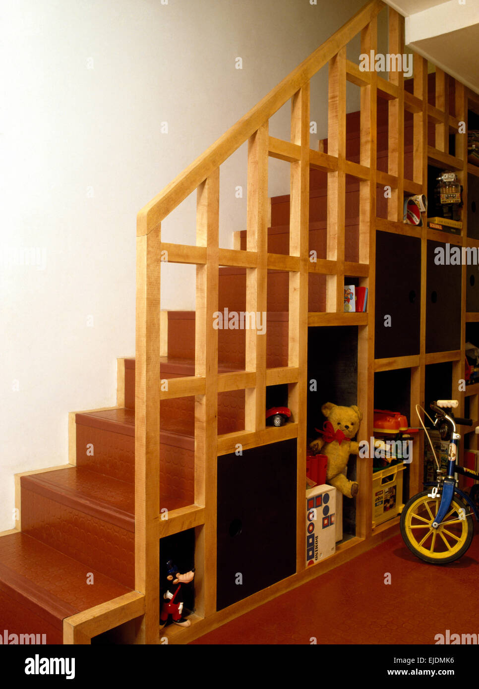 Storage below staircase in eighties hall Stock Photo