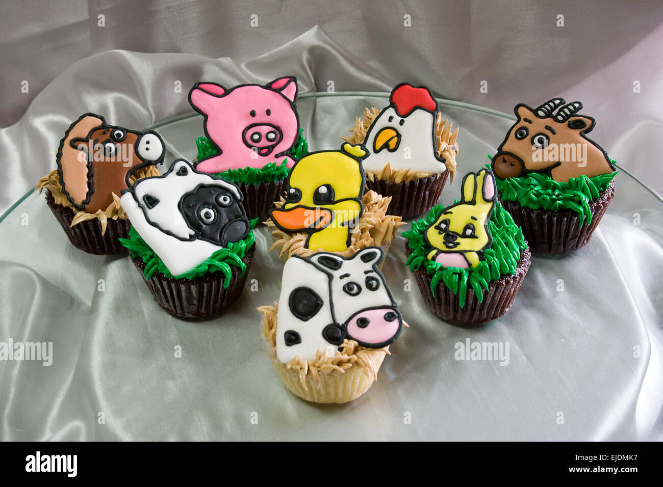 Cupcakes with a farm animal theme Stock Photo - Alamy