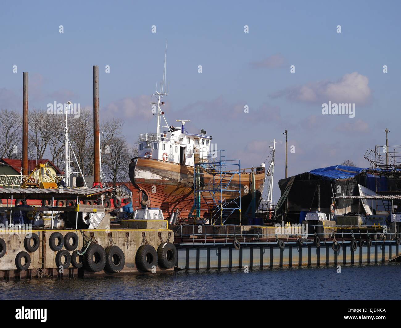 fishing boat in the shipyard on sky background Stock Photo