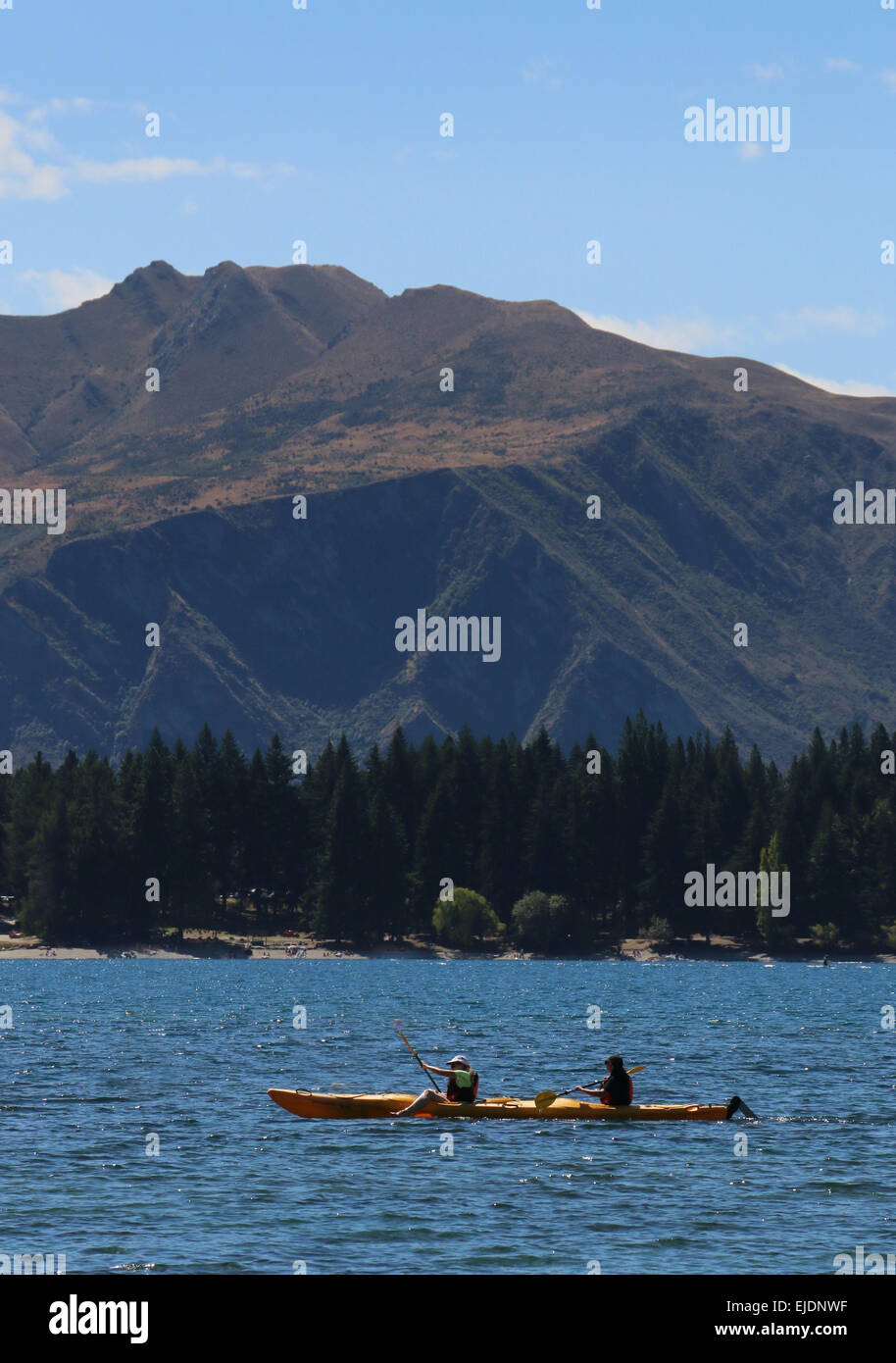 Kayakers on Wanaka lake, Otago Lakes region New Zealand Stock Photo
