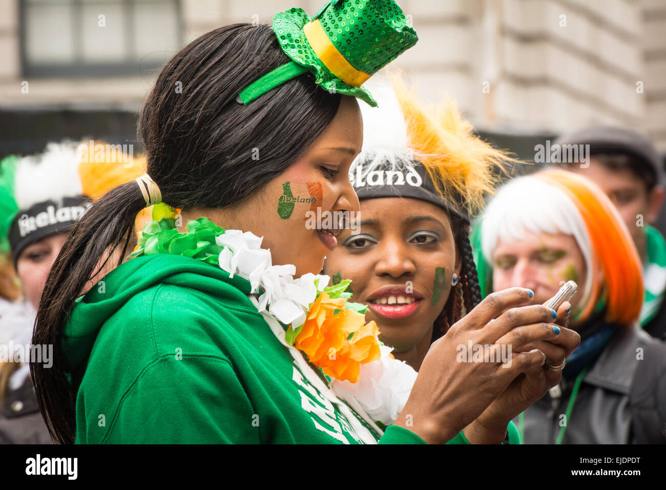 African Irish girls wearing green and celebrating St Patrick's day in Dublin 2015 Stock Photo